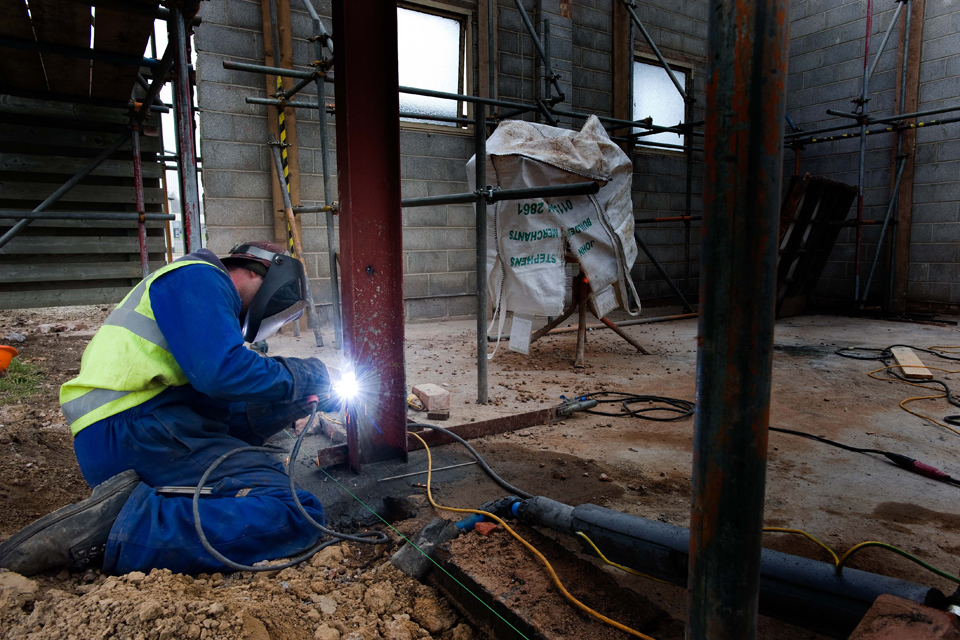 A construction worker carries out structural work