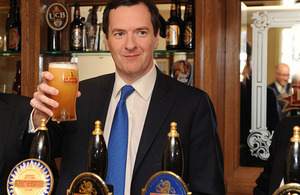 Chancellor holding a pint of ale