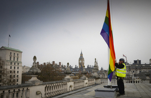 Rainbow flag being raised over 70 Whitehall