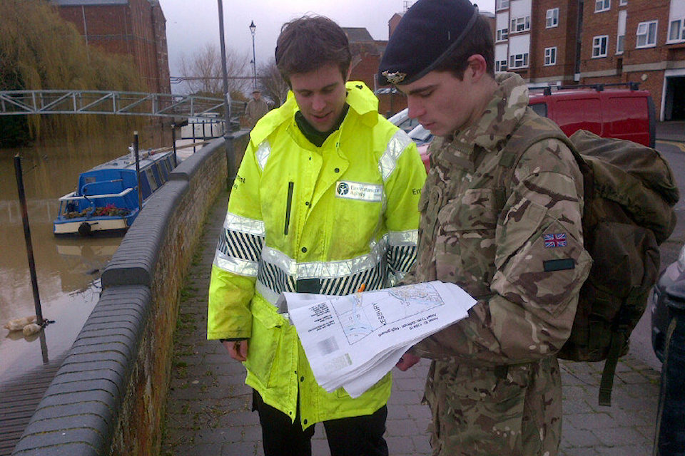 environment agency staff inspecting water levels