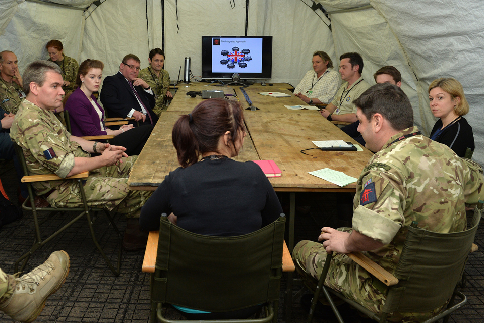 Mark Francois receives a briefing from members of the Combined Joint Task Force Headquarters