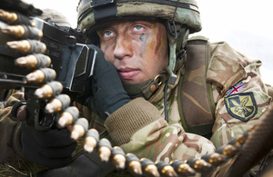 A paratrooper from 16 Air Assault Brigade takes up a defensive position on arrival at the Kinloss airfield [Picture: Senior Aircraftwoman Tracey Dobson, Crown copyright]