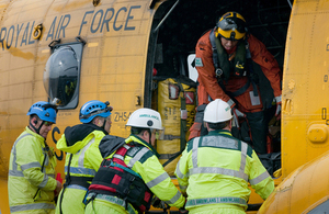Members of the Welsh Ambulance Service prepare to remove a casualty from the 22 Squadron Royal Air Force Sea King [Picture: Senior Aircraftwoman Gina Edgcumbe, Crown copyright]