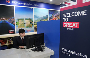 New Visa centre employee testing out latest customer cubicles.