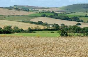 Photograph of the countryside, showing fields and hills