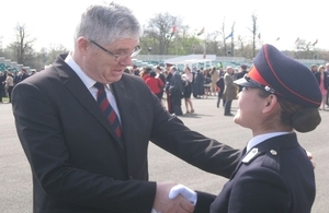 Bosnian Minister of Defence Zekerijah Osmic congratulates 2nd Lt Edita Karahasanovic for graduating from the Sandhurst Academy