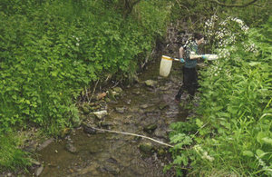 Environment officer collects evidence of environmental damage