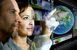 Man and woman looking at a computer screen (image by istockphoto)