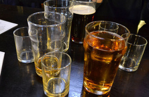 A number of beer glasses on a table