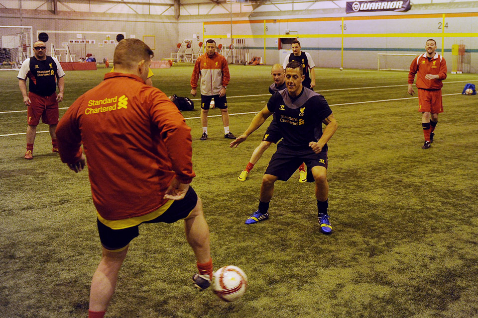 Armed forces veterans enjoy a football coaching session