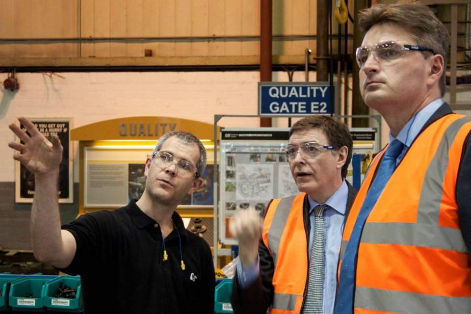 Philip Dunne and Daniel Kawczynski join the post-event tour of the Caterpillar factory