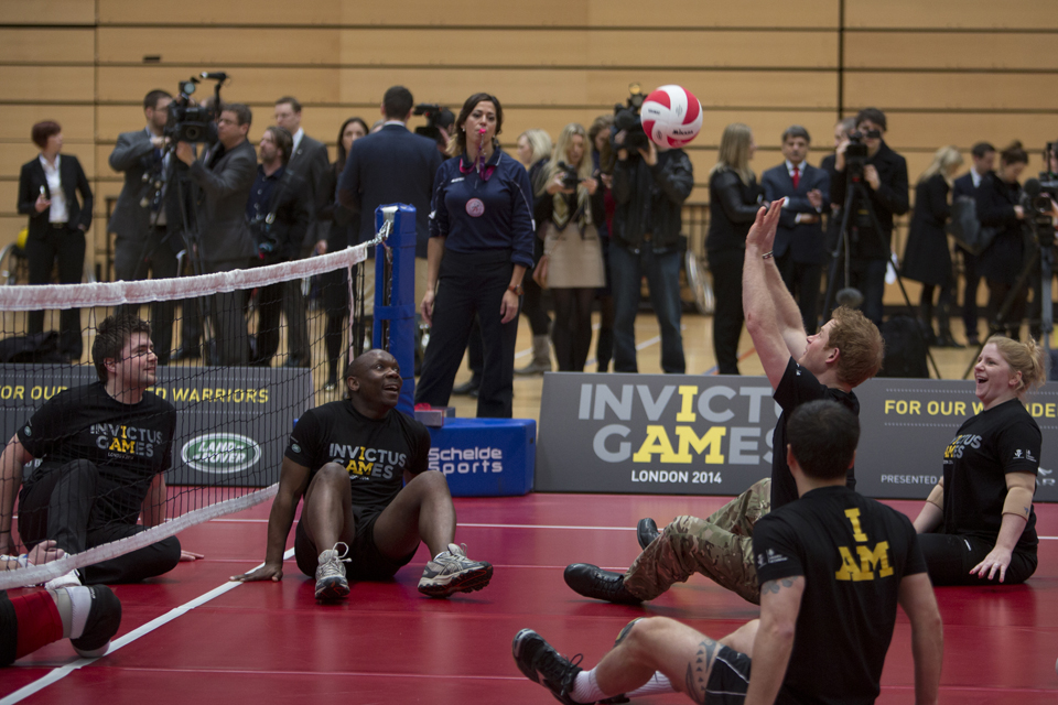 Prince Harry joins in with a sitting volleyball game