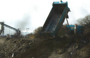 Vehicle tipping waste at waste site