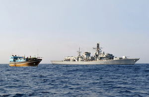 HMS Somerset alongside the dhow [Picture: Leading Airman (Photographer) Nicky Wilson, Crown copyright]