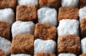 Brown and White sugar cubes arranged in a row