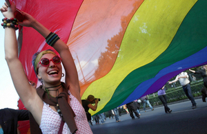 Woman Holding Rainbow Flag