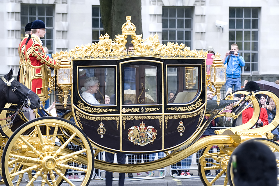 The Queen's carriage makes its way to the Houses of Parliament