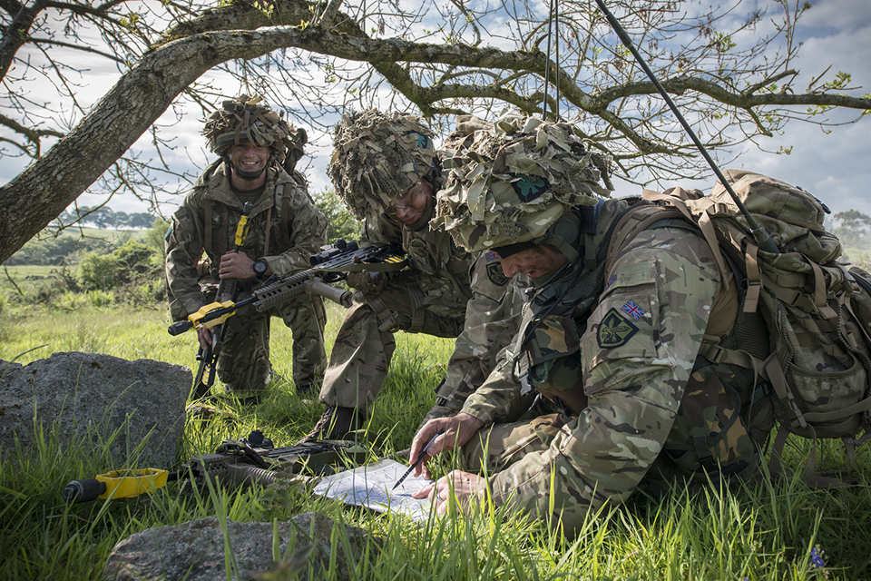 A reservist company commander briefs his team