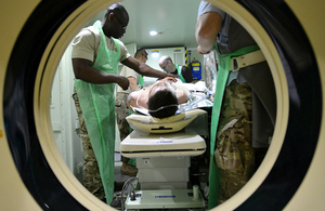 Medical staff on a training exercise prepare a casualty for a portable CT scanner (library image) [Picture: Sergeant Paul Morrison RLC, Crown copyright]