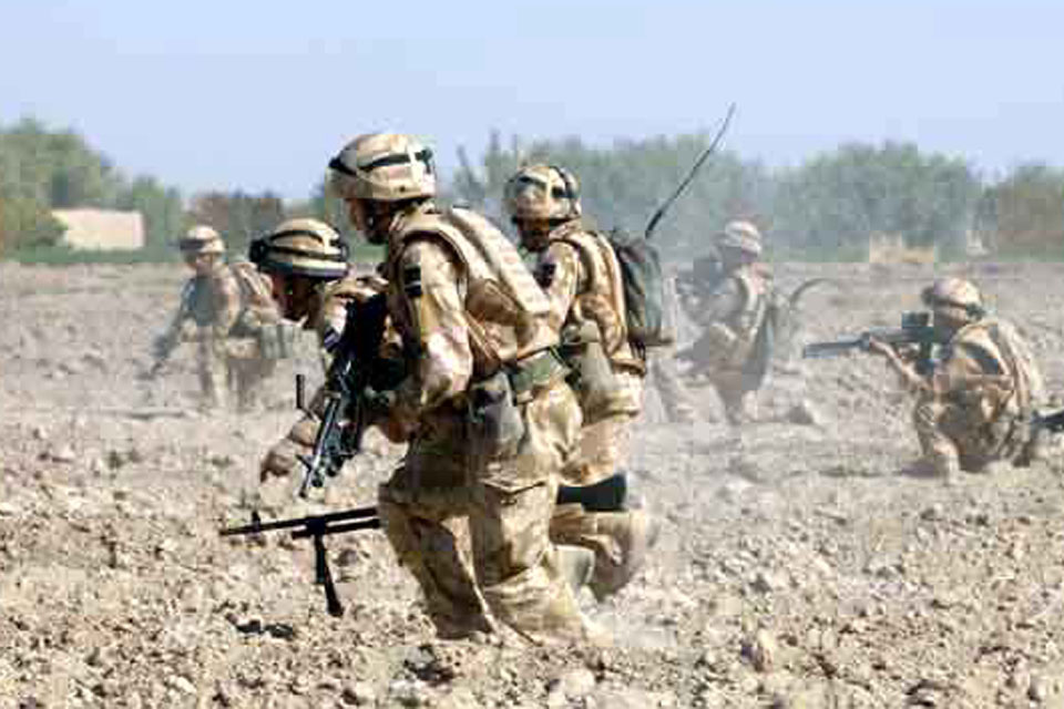 Coldstream Guards check out enemy movements around Forward Operating Base Keenan near Zumbelay in Helmand province in 2008 (stock image)