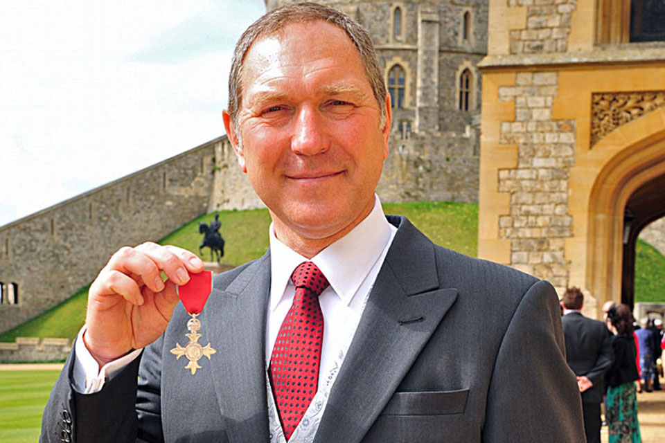 Kevin Capon proudly displays his MBE, awarded by Her Majesty The Queen at Windsor Castle 