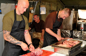 Corporal Ian Dixon (left) and Private Scott Gordon prepare a meal in Forward Operating Base Jackson, Sangin