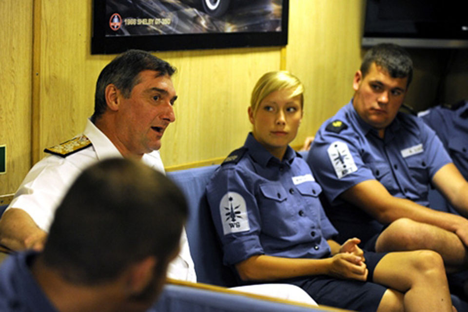 Admiral Soar chats with some of HMS Cornwall's junior rates in one of the frigate's messes