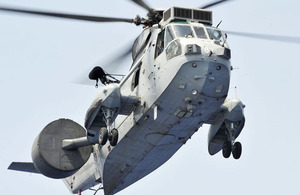 An 857 Naval Air Squadron Sea King takes off from HMS Ocean