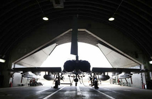 An airframe emerges from its hardened shelter for a sortie