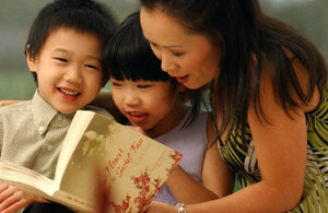 Mother reading to her children