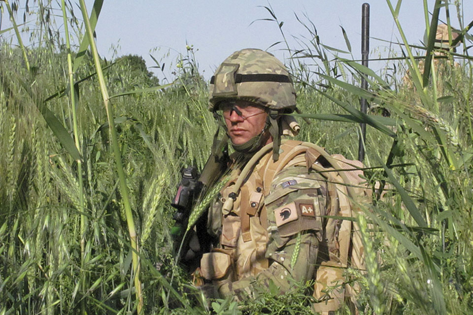 Territorial soldier Lance Corporal Martin Goodright hunkers down in the long grass