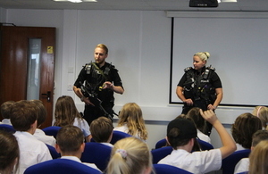 School children meet cnc officers in classroom