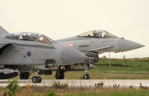 Royal Air Force Typhoon and Tornado GR4 aircraft power up on the threshold at Gioia del Colle air base in southern Italy