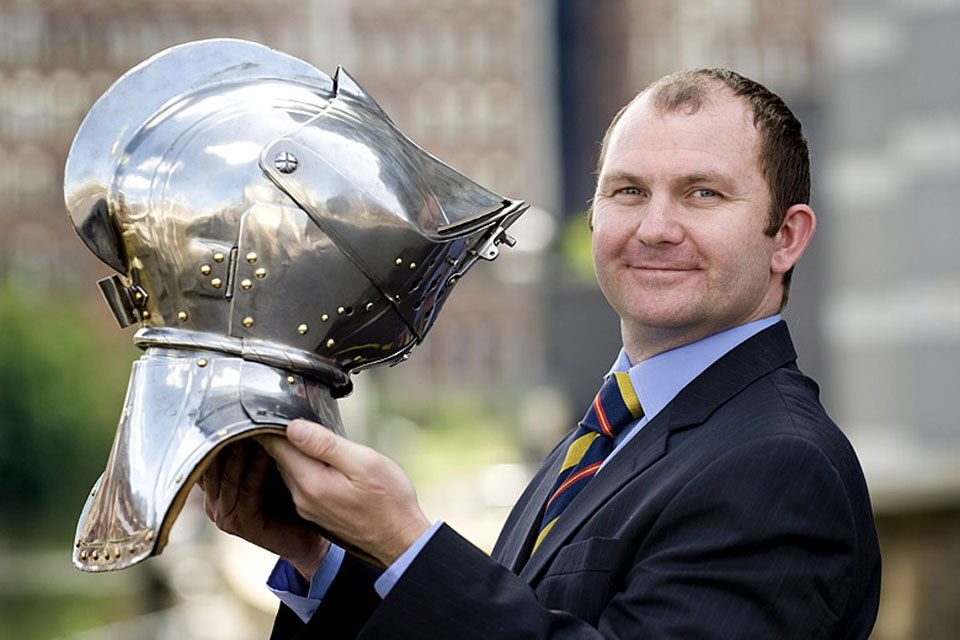 Lance Corporal Brown with a steel helmet from the national collection held at the Royal Armouries Museum in Leeds