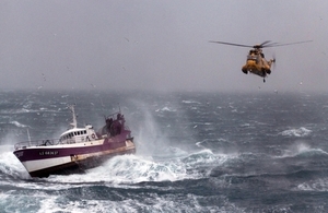 Royal Navy Sea King helicopter comes to the aid of a fishing vessel