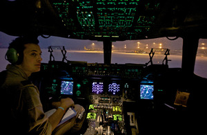 Co-pilot Flight Lieutenant Alex Stones, 99 Squadron, on the flight deck of an RAF C17 at RAF Brize Norton