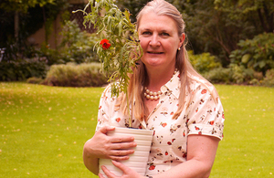 Ambassador le Jeune d'Allegeershecque planting poppy for WW1 commemorations