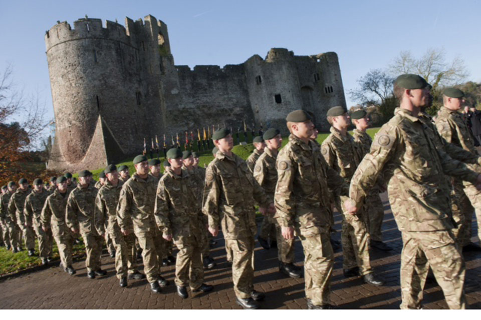 Soldiers of 1st Battalion The Rifles march past Chepstow Castle
