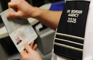 Border Service checking a passport