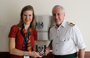 Lt Col David Harrison hands his military memorabilia to Deputy Head of Mission Rosie Tapper