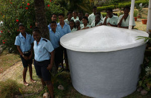 SAHTC students beside the prison made water tank