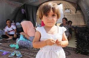 An Iraqi refugee girl with her family at Newroz camp. Picture: Rachel Unkovic/International Rescue Committee