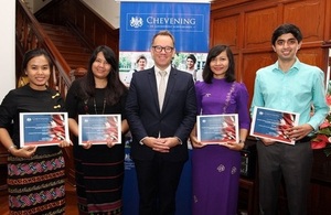 Chargé d'affaires of the British Embassy Rangoon, Mr Matthew Hedges, with four Chevening Scholars