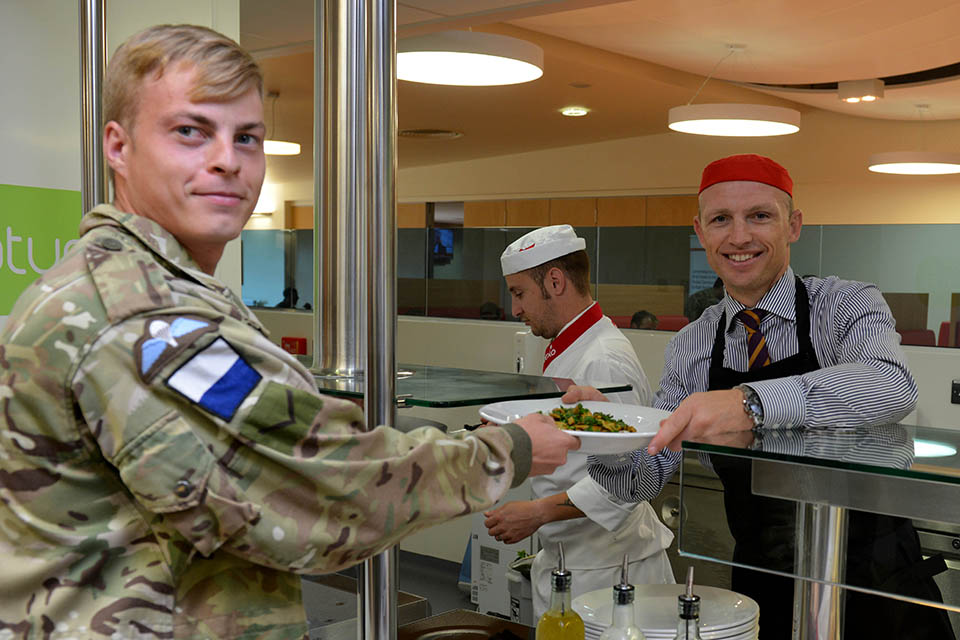 Matt Dawson serving a soldier at one of the new Merville Barracks restaurants