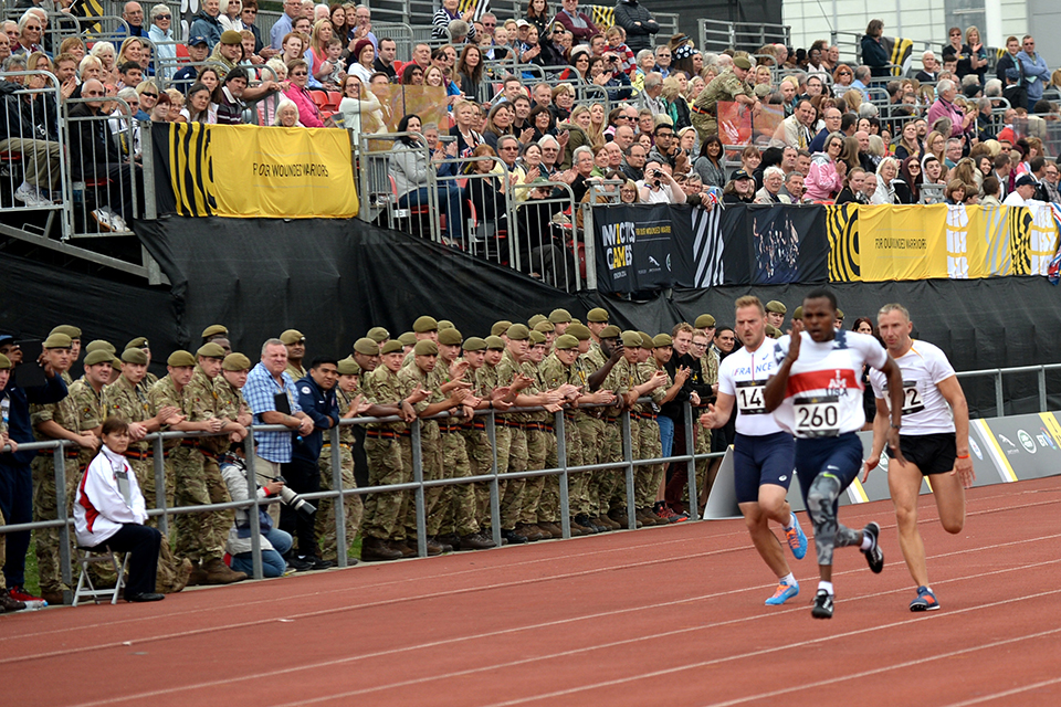Members of the armed forces showing their support for the competitors