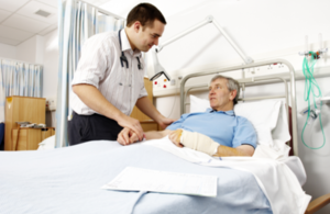 Doctor talking to a patient in a hospital bed