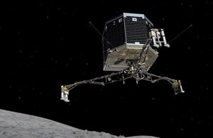 Philae lander descending onto comet surface.