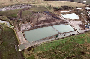 An aerial view shows the breach in the tidal defences