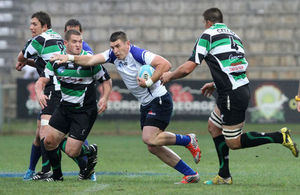 Cell C Community Cup Player of the Tournament, Michael Nienaber, powers through a gap during this year’s final at Outeniqua Park in George