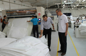 Ambassador Charles Garrett is given a tour of the Comfy Angel factory in Prilep